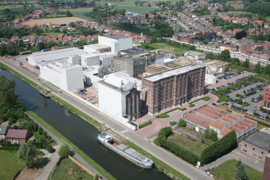 Aerial view of BENEO’s rice ingredient production site in Wijgmaal, Belgium, beside a canal and residential area.